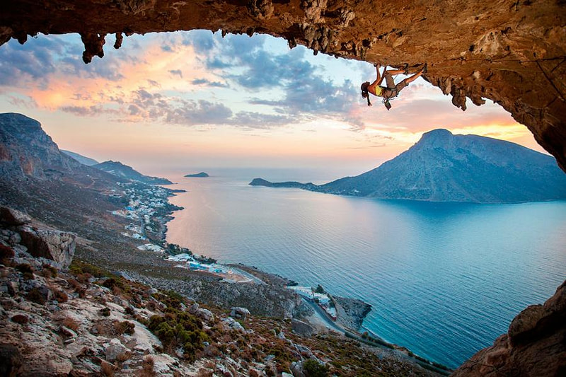 view from cave of the sea surrounded by mountains
