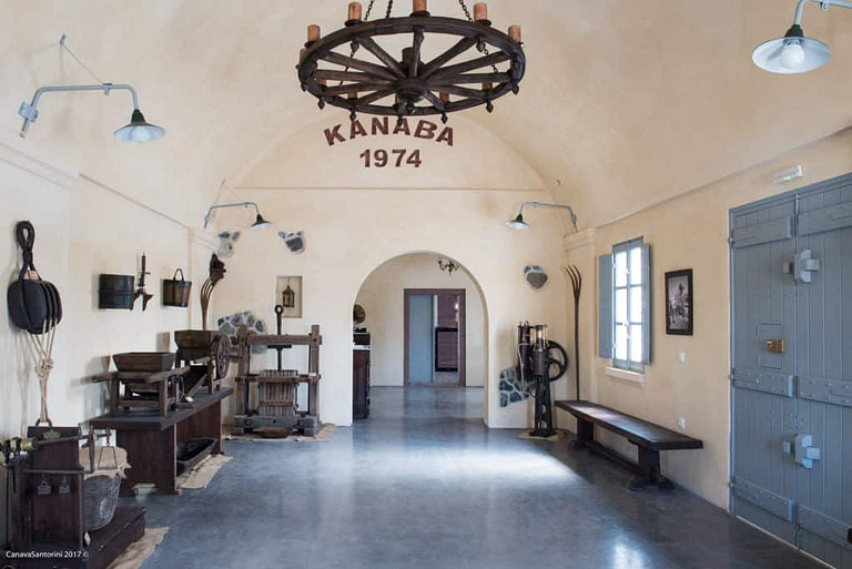 exhibition room with old traditional wooden utensils at 'Canava Santorini'