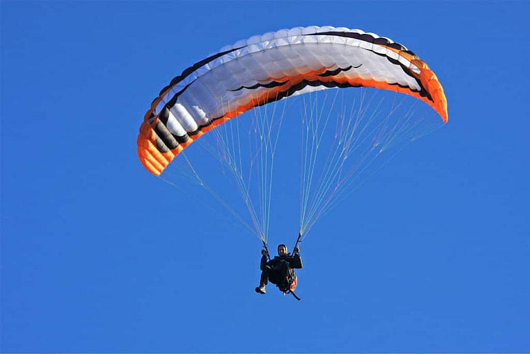 man doing paragliding at Country Hotel Velani