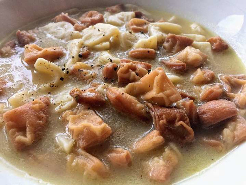 Close-up of Greek ‘Maggiri’ food means thick pasta soup served, topped with lots of cheese