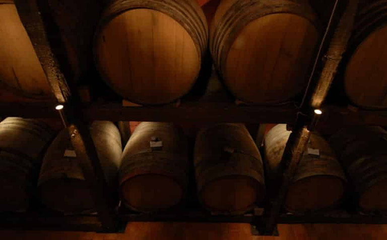 wine wooden barrels in 'Koutsoyannopoulos winery' cellar