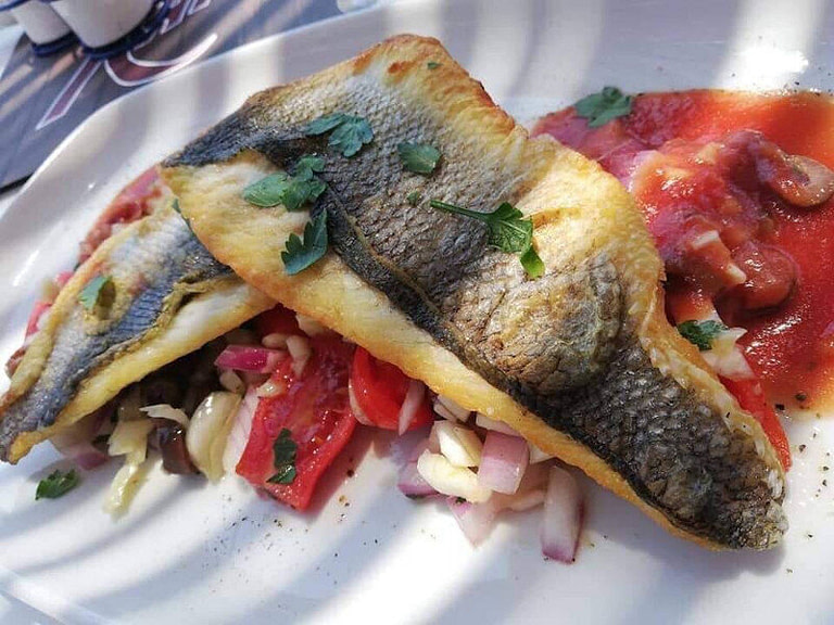 plate with cooked fish from Gastronomic trips and why you should take one