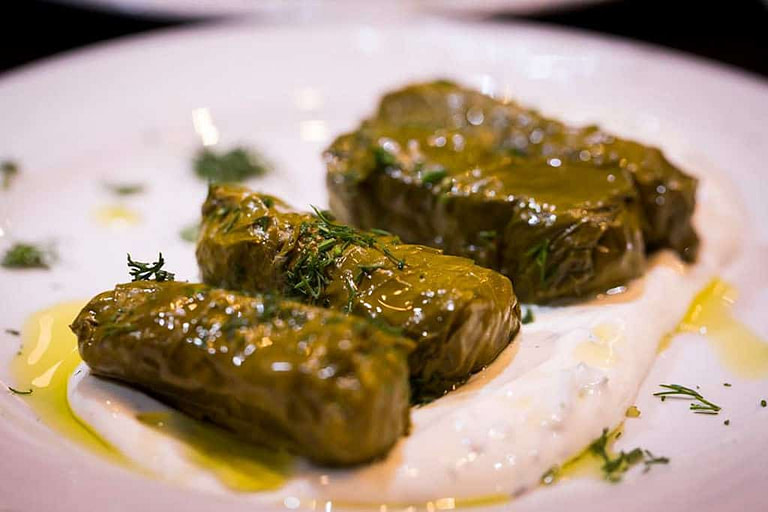 Greek dolmades cooked on the plate from 'Marianna'