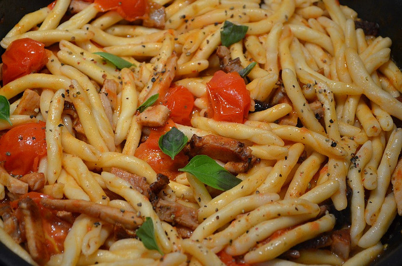 Close-up of Greek ‘Makarouni skioufichta’ food like Gemelli pasta cooked with tomatoes sauce