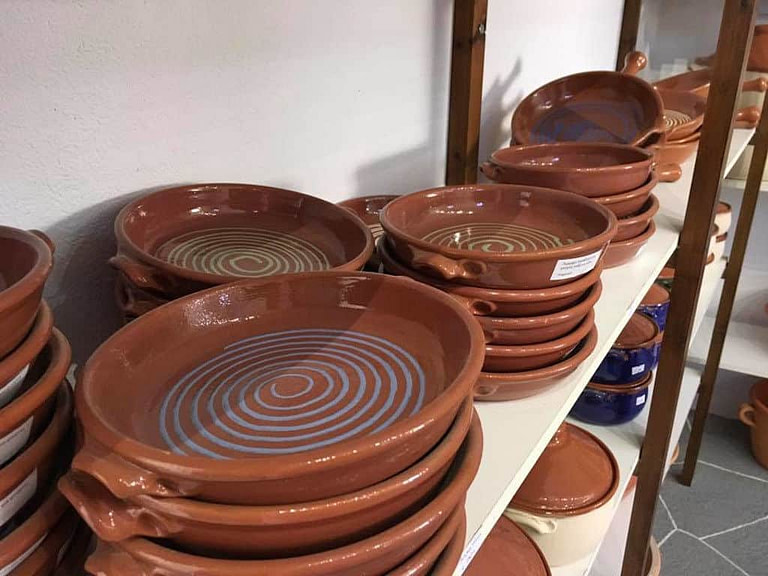 close-up of ceramic plates on shelve at 'Narlis Farm' on top of each others