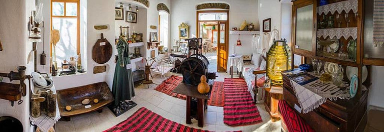 old traditional utensils, furniture, clothing and carpets at Aristaios' folklore museum