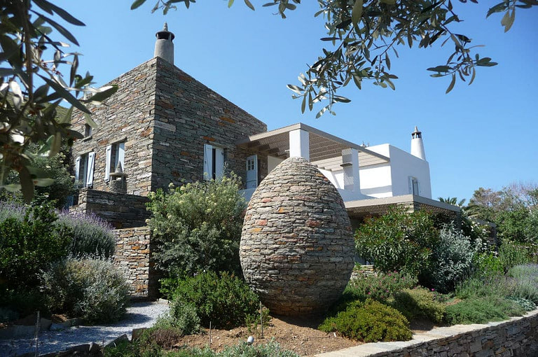 stone sculpture represents an acornon in the front of 'Red Tractor Farm' building
