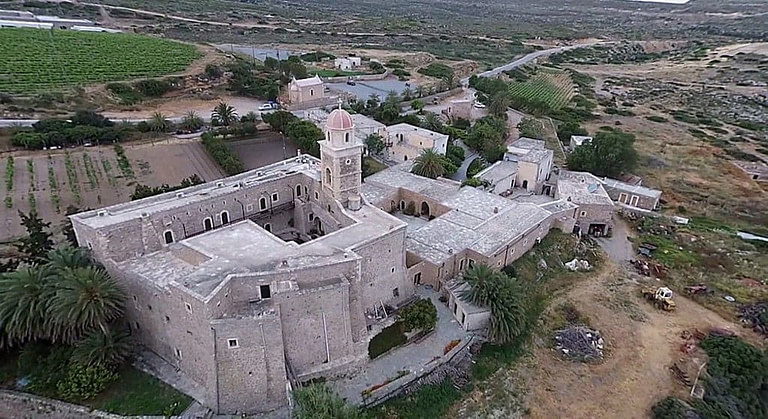 Toplou Monastery with old stone walls and Bio Sitia company