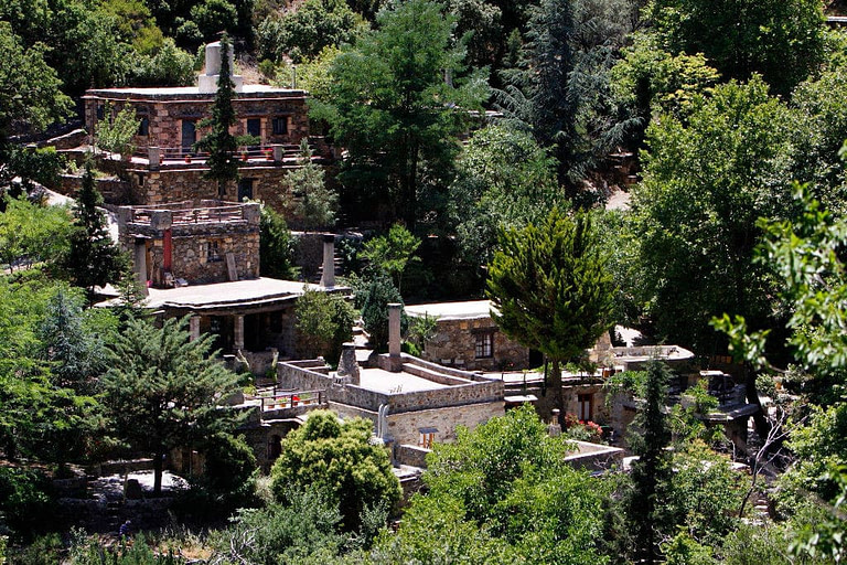 'Milia Mountain Retreat' complex of stone buildings surrounded by trees