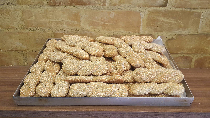 Bakery pan with Greek ’tahinokouloura’, cookies with small strips with the thickness of the little finger from tahini