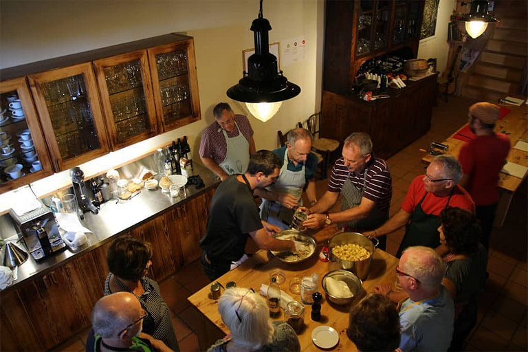 tourists cooking in the kitchen of 'Milia Mountain Retreat' restaurant